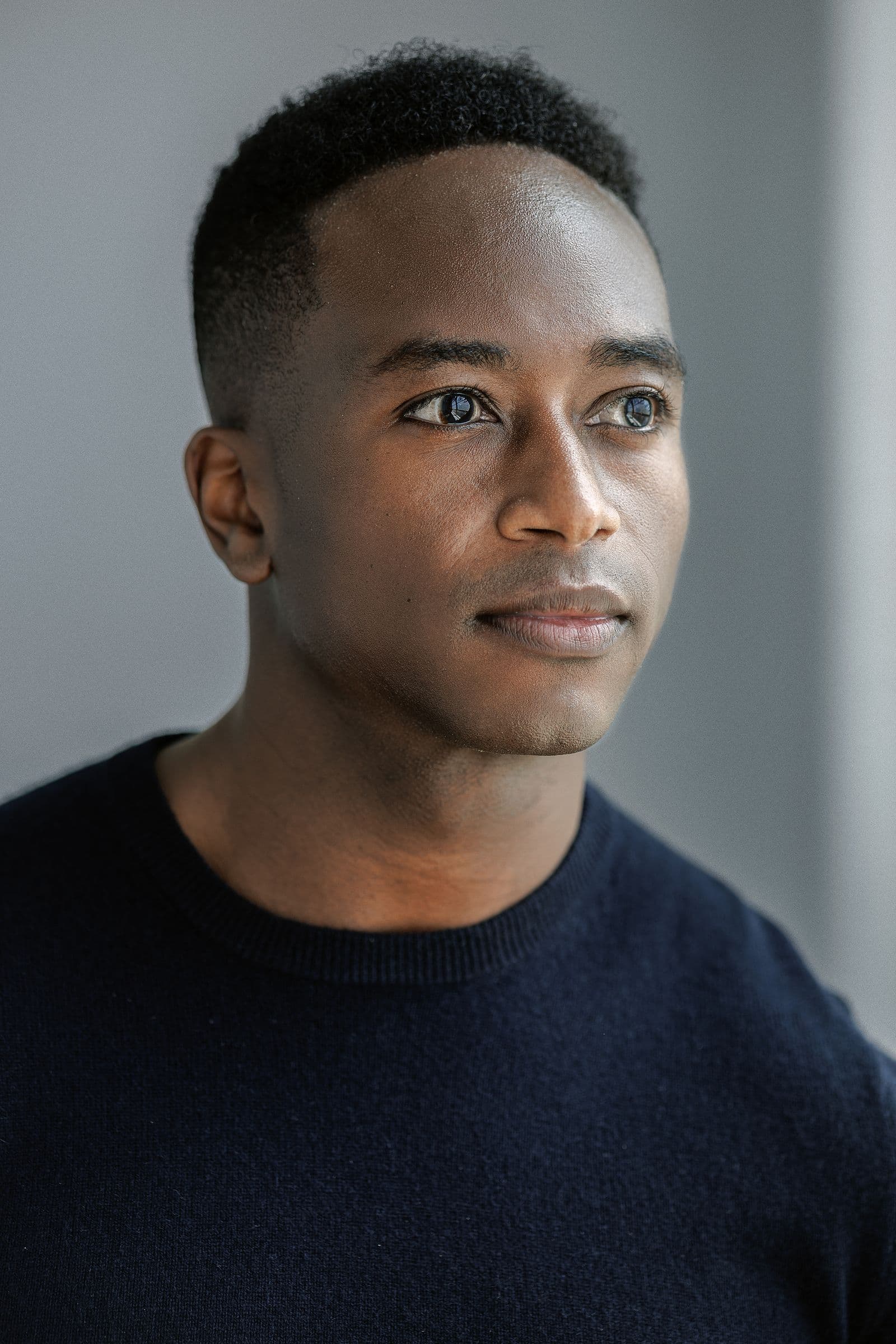 Marc Collier in a navy crew-neck